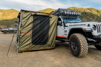 Adventure Co. Rooftop Awning Room in Forest Green shown on a Jeep Rubicon